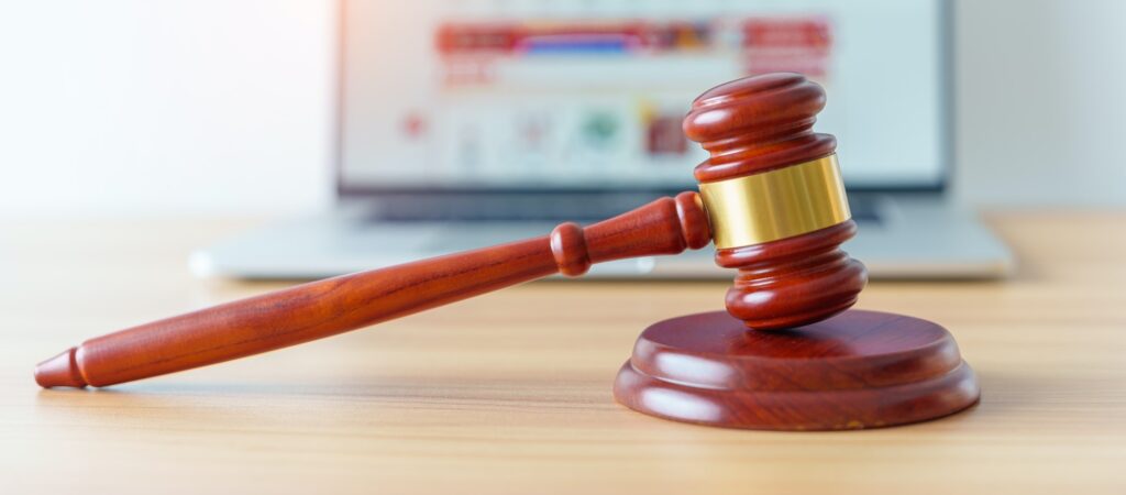judge gavel and laptop computer for online shopping